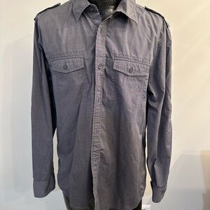 American Rag mens button down with accent on shoulder and two chest pockets.